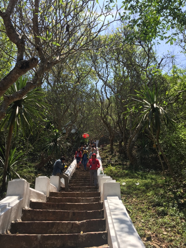 Climbing up the steps to Mount Phousi